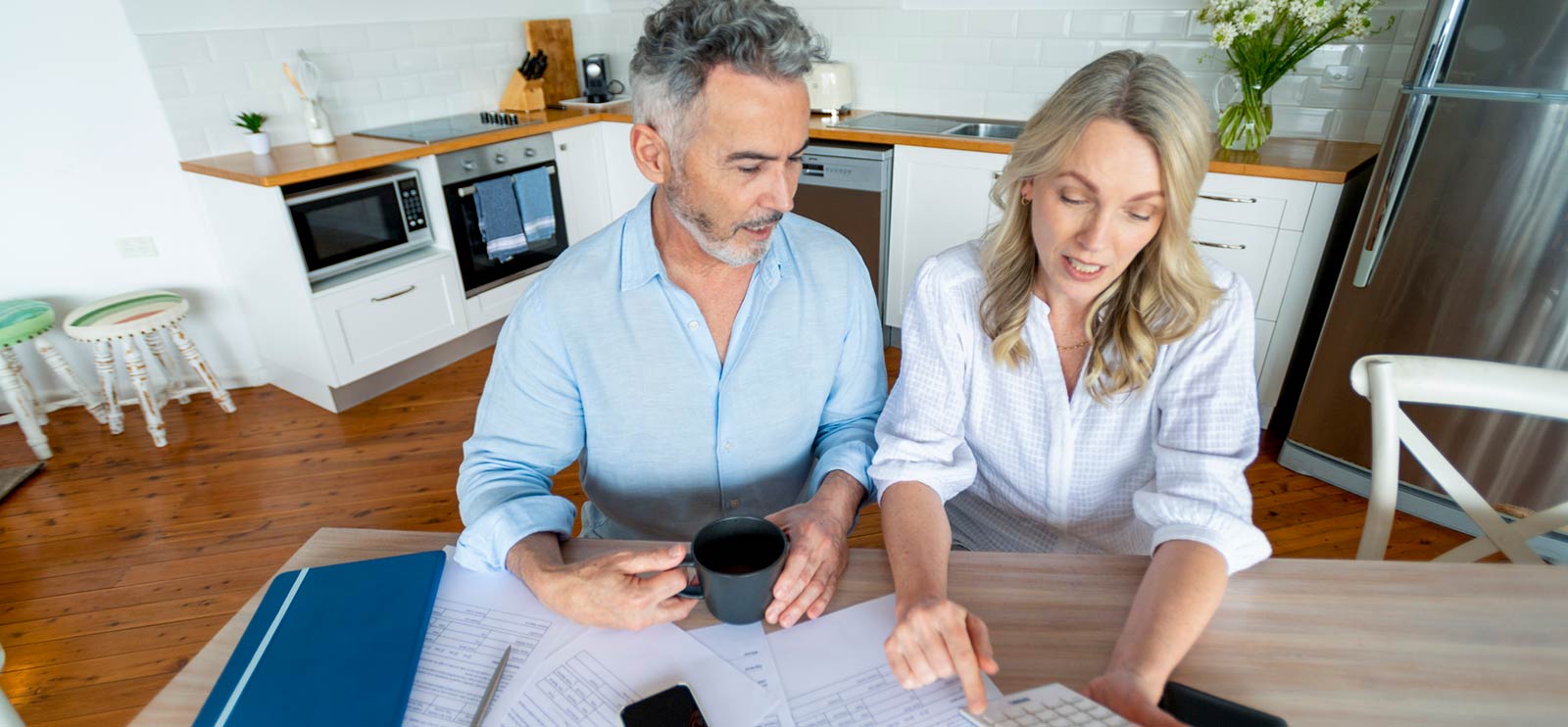 A couple going over loan options in their home