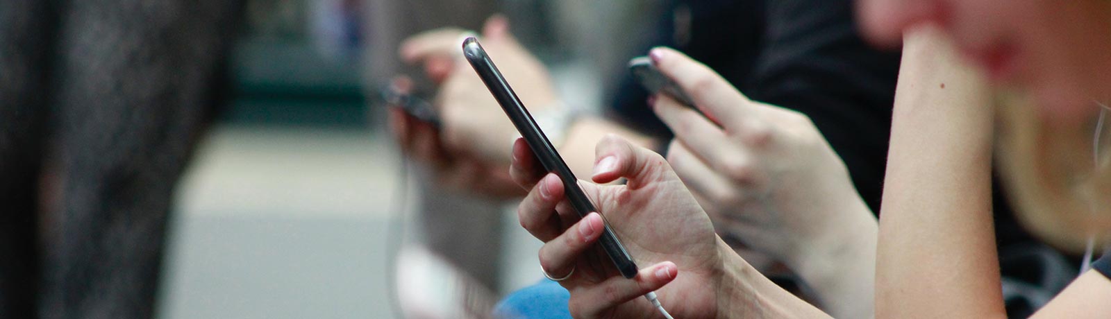 A group of people using smartphones