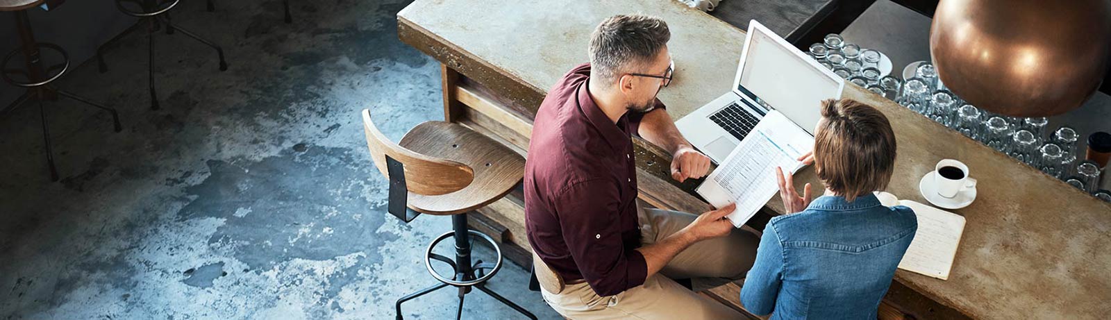 Small business owner meeting with a loan officer about a business loan